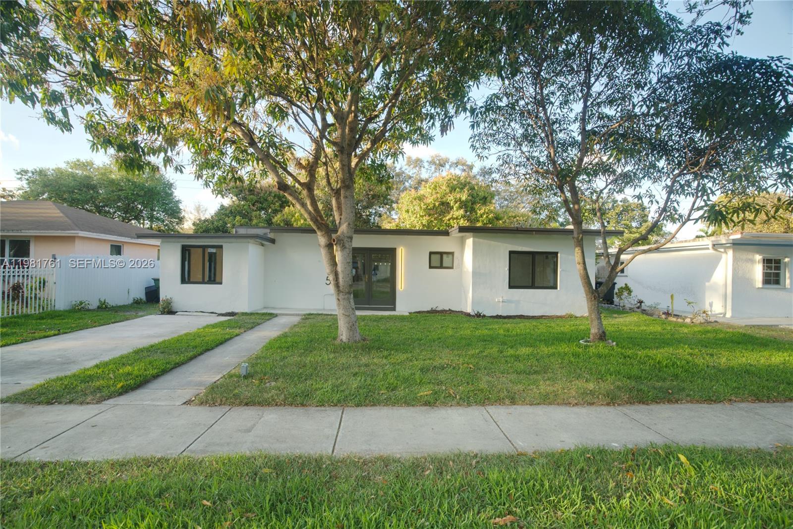 315 Northwest 127th Street North Miami, FL 33168 - Photo 3 of 67 a view of a house with a yard