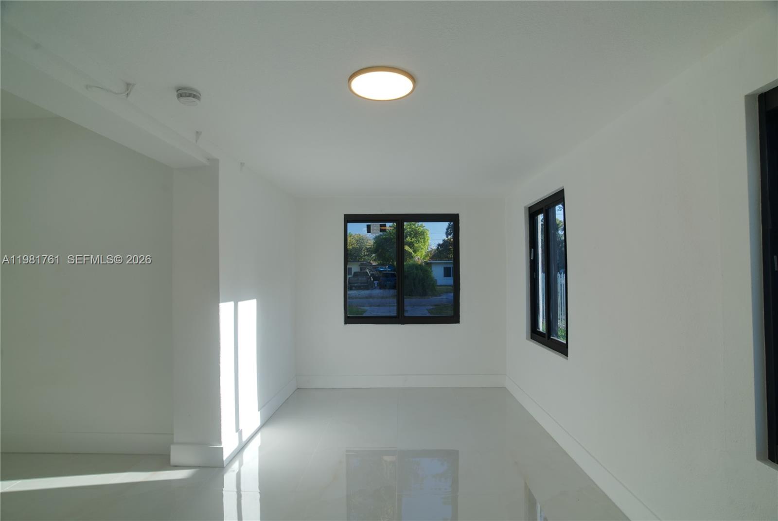 315 Northwest 127th Street North Miami, FL 33168 - Photo 39 of 67 a view of an empty room with window