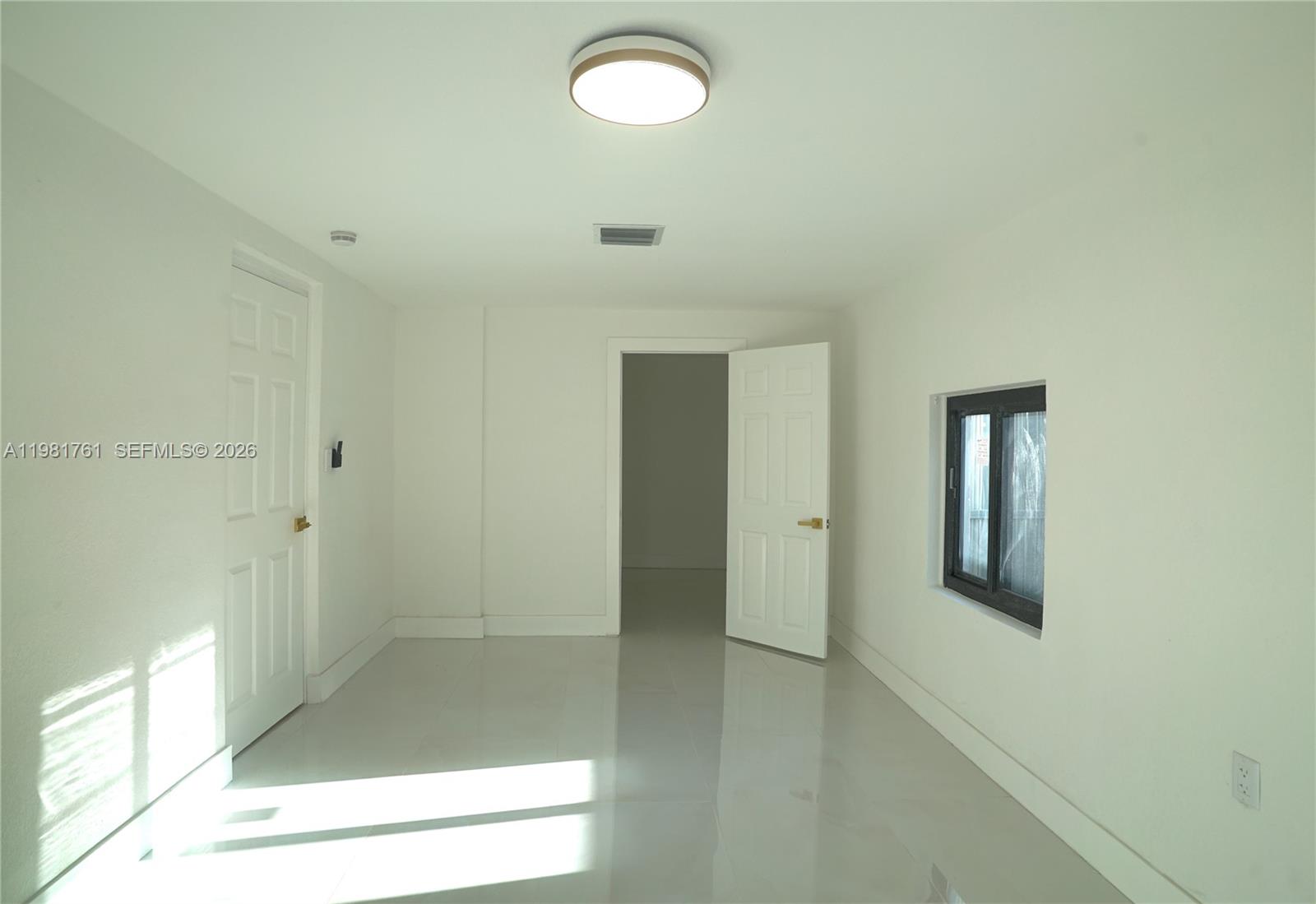315 Northwest 127th Street North Miami, FL 33168 - Photo 42 of 67 a view of a hallway with wooden floor