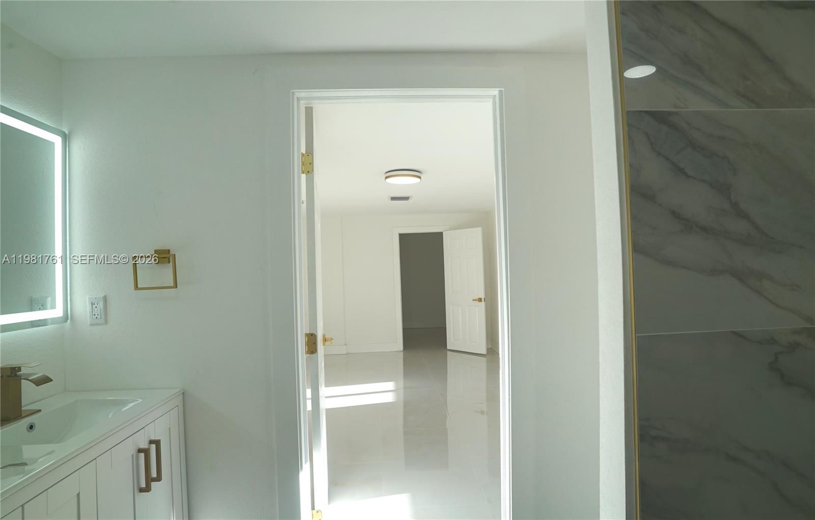 315 Northwest 127th Street North Miami, FL 33168 - Photo 46 of 67 a bathroom with a sink and mirror