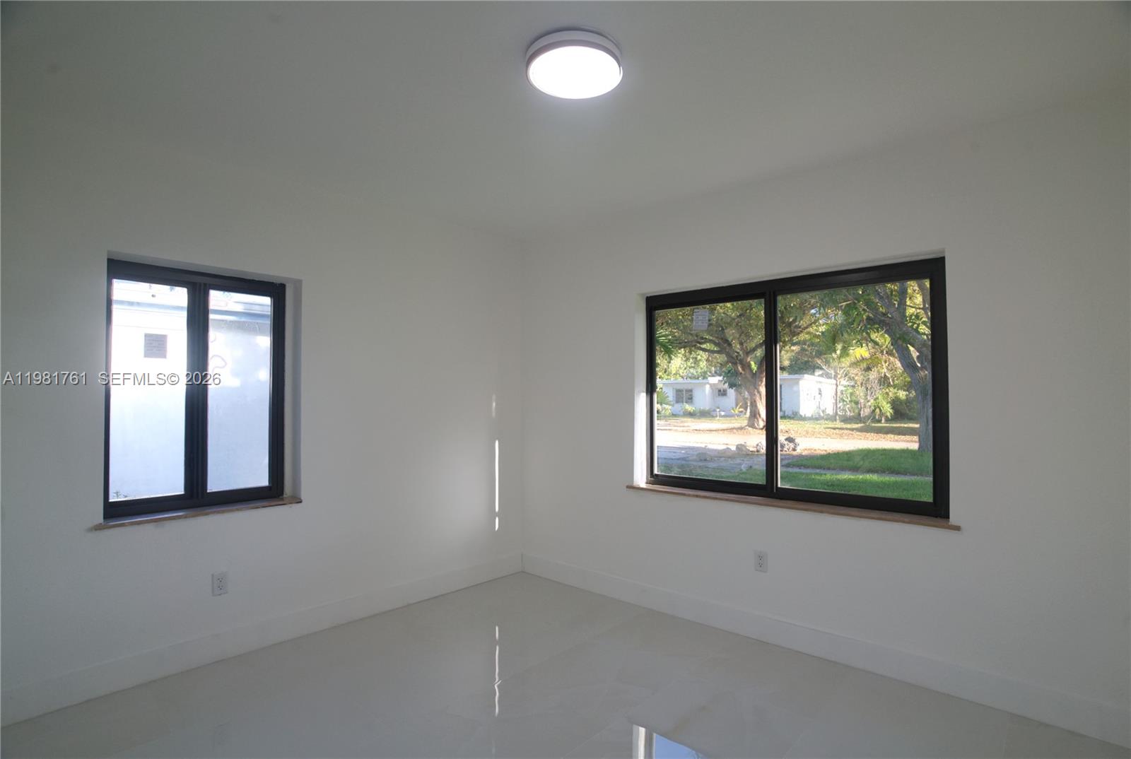 315 Northwest 127th Street North Miami, FL 33168 - Photo 47 of 67 an empty room with windows
