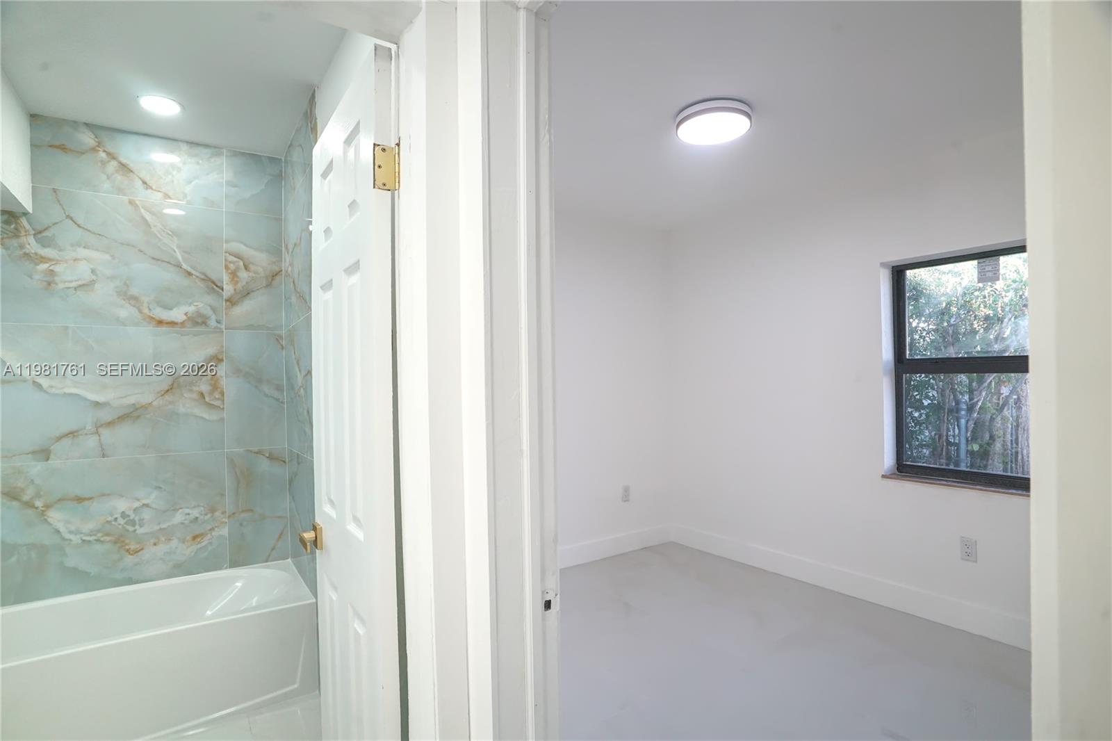 315 Northwest 127th Street North Miami, FL 33168 - Photo 50 of 67 a bathroom with a bathtub and a shower