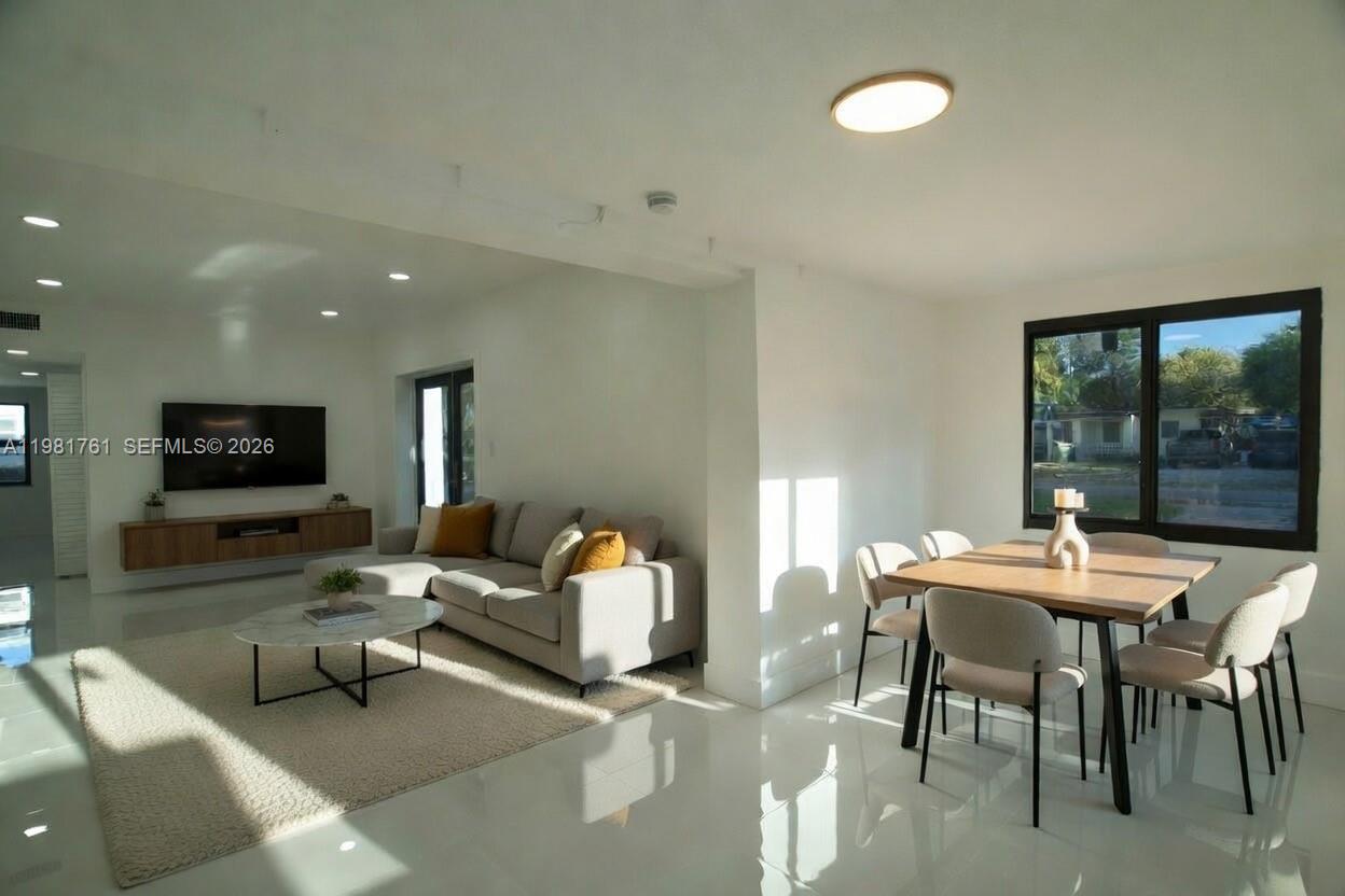315 Northwest 127th Street North Miami, FL 33168 - Photo 5 of 67 a living room with furniture and a flat screen tv