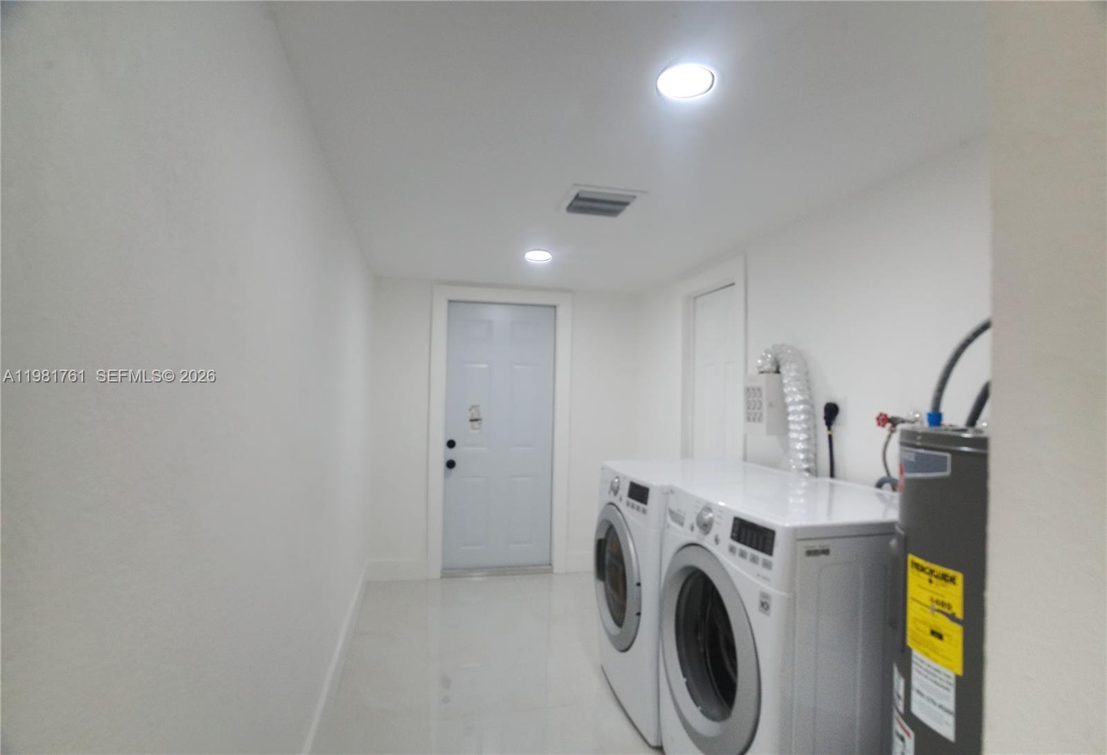 315 Northwest 127th Street North Miami, FL 33168 - Photo 55 of 67 a view of a storage & utility room with washer and dryer