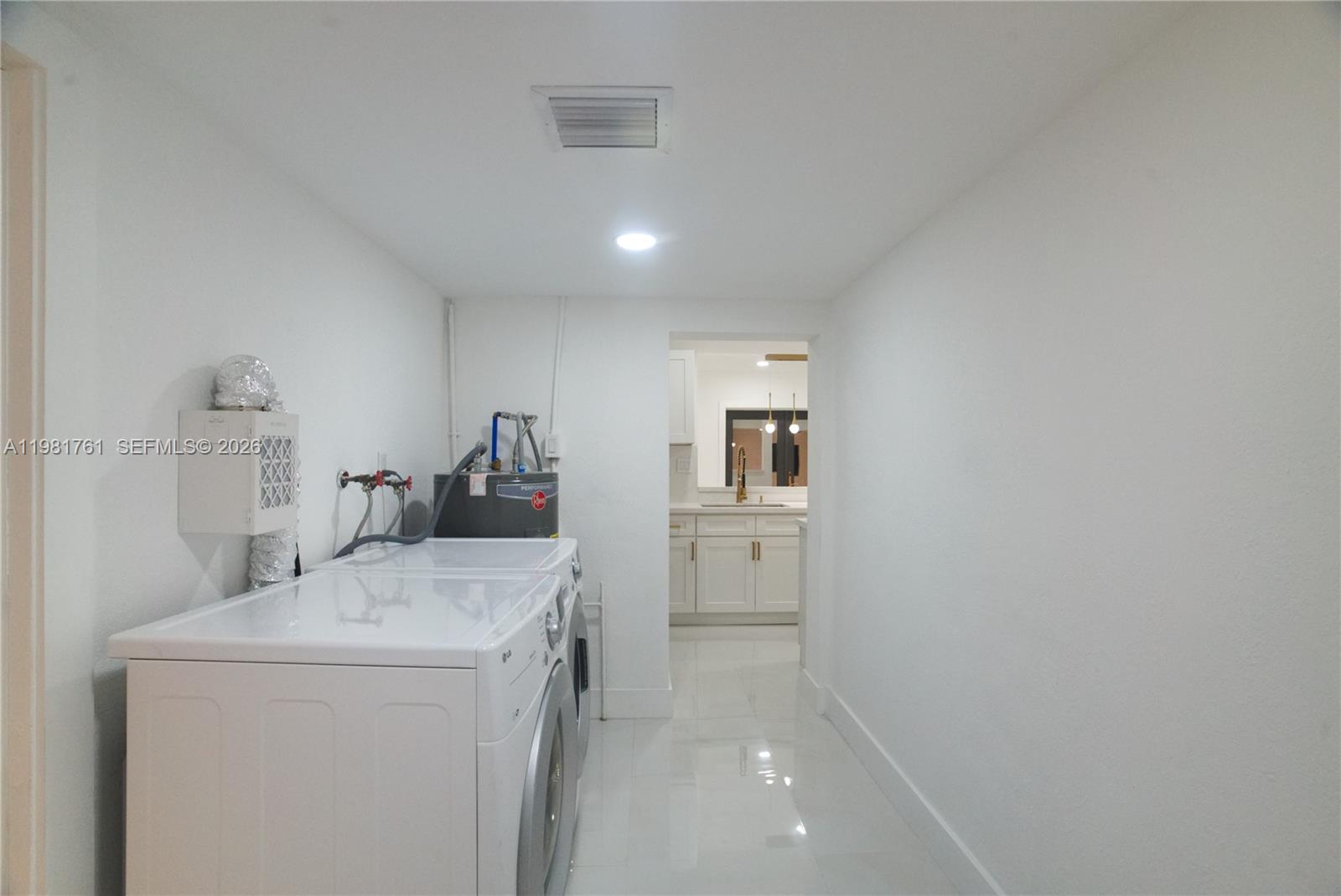 315 Northwest 127th Street North Miami, FL 33168 - Photo 56 of 67 a room with a sink and a washer dryer