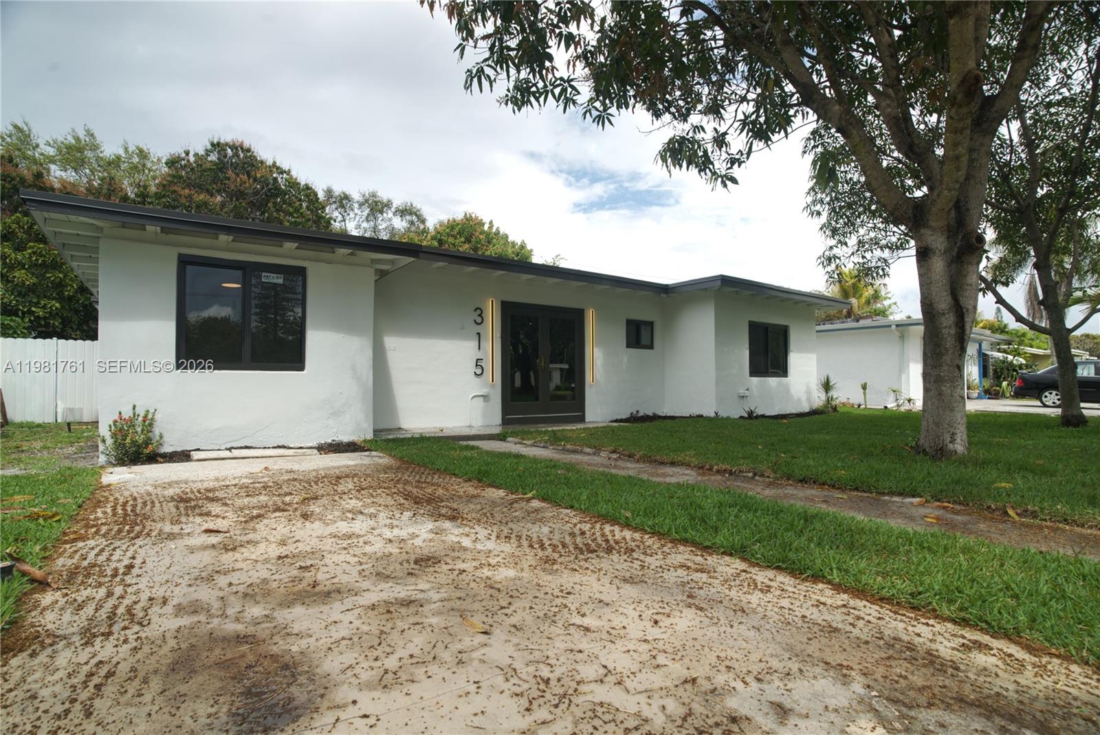 315 Northwest 127th Street North Miami, FL 33168 - Photo 60 of 67 a view of a house with a backyard