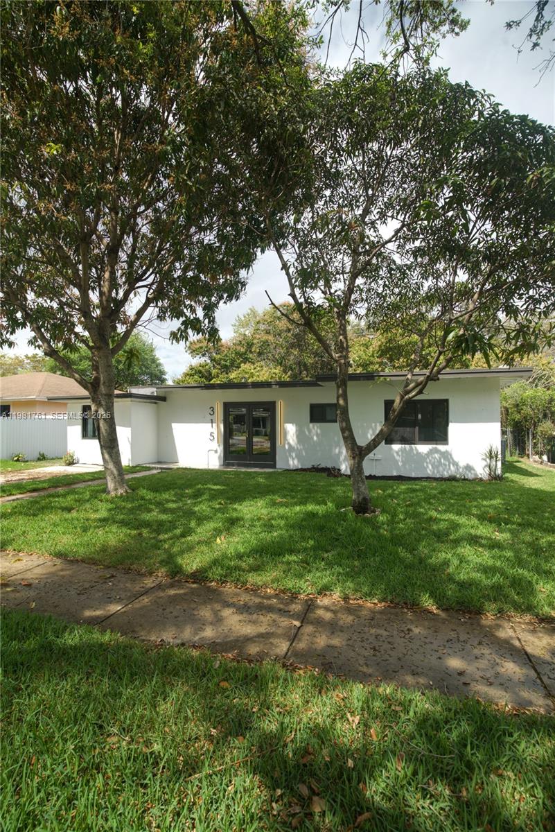 315 Northwest 127th Street North Miami, FL 33168 - Photo 64 of 67 a front view of a house with garden