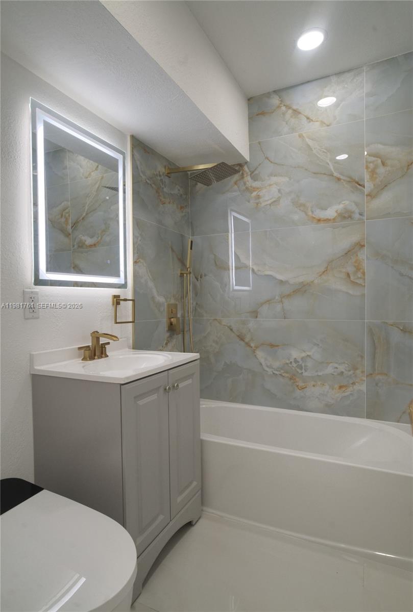 315 Northwest 127th Street North Miami, FL 33168 - Photo 67 of 67 a bathroom with a bathtub and a sink