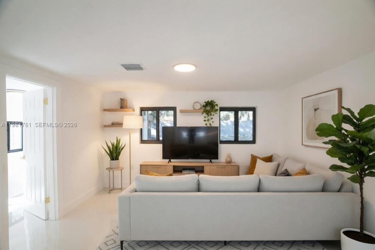 315 Northwest 127th Street North Miami, FL 33168 - Photo 7 of 67 a living room with furniture and a flat screen tv