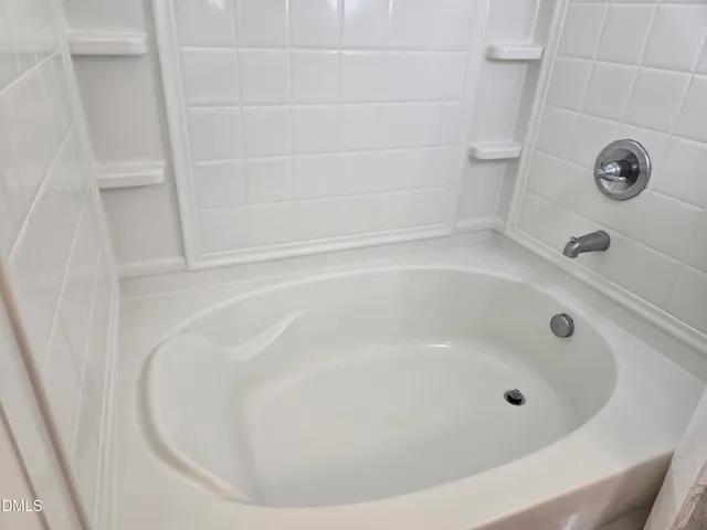 a close view of a bathtub in a bathroom