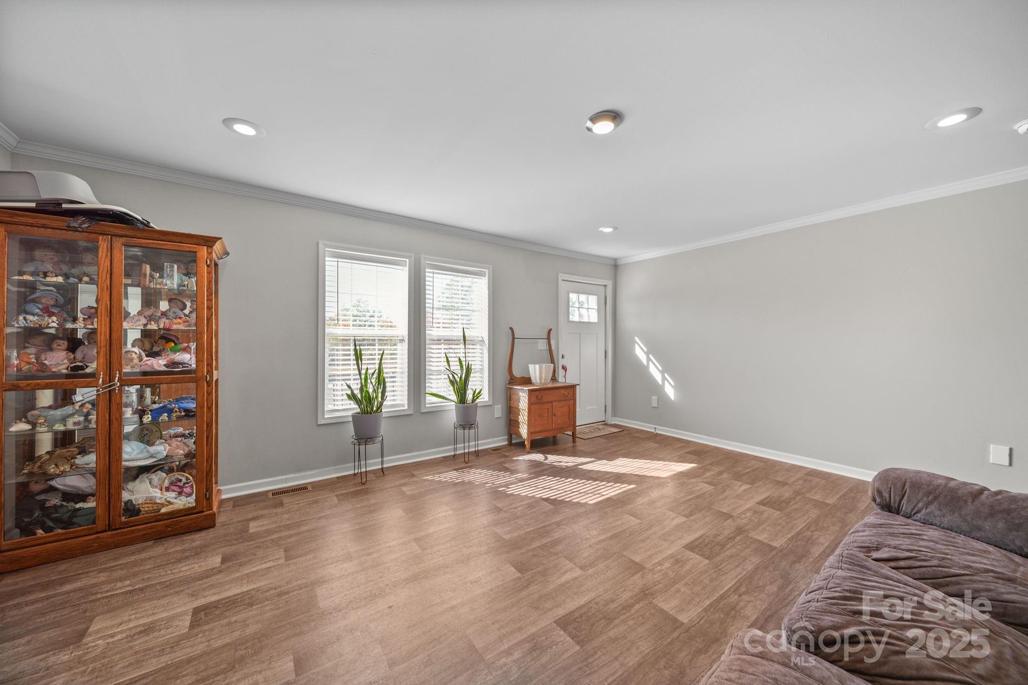 428 Long Branch Jefferson, SC 29718 - Photo 14 of 27 a view of an empty room with window and wooden floor