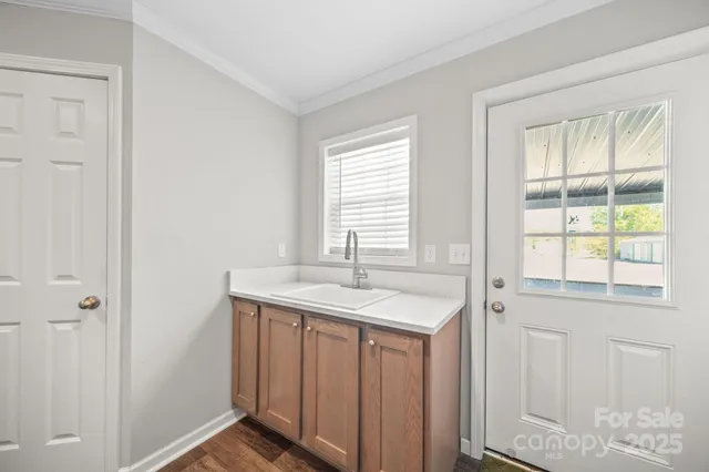 a bathroom with a sink and a window