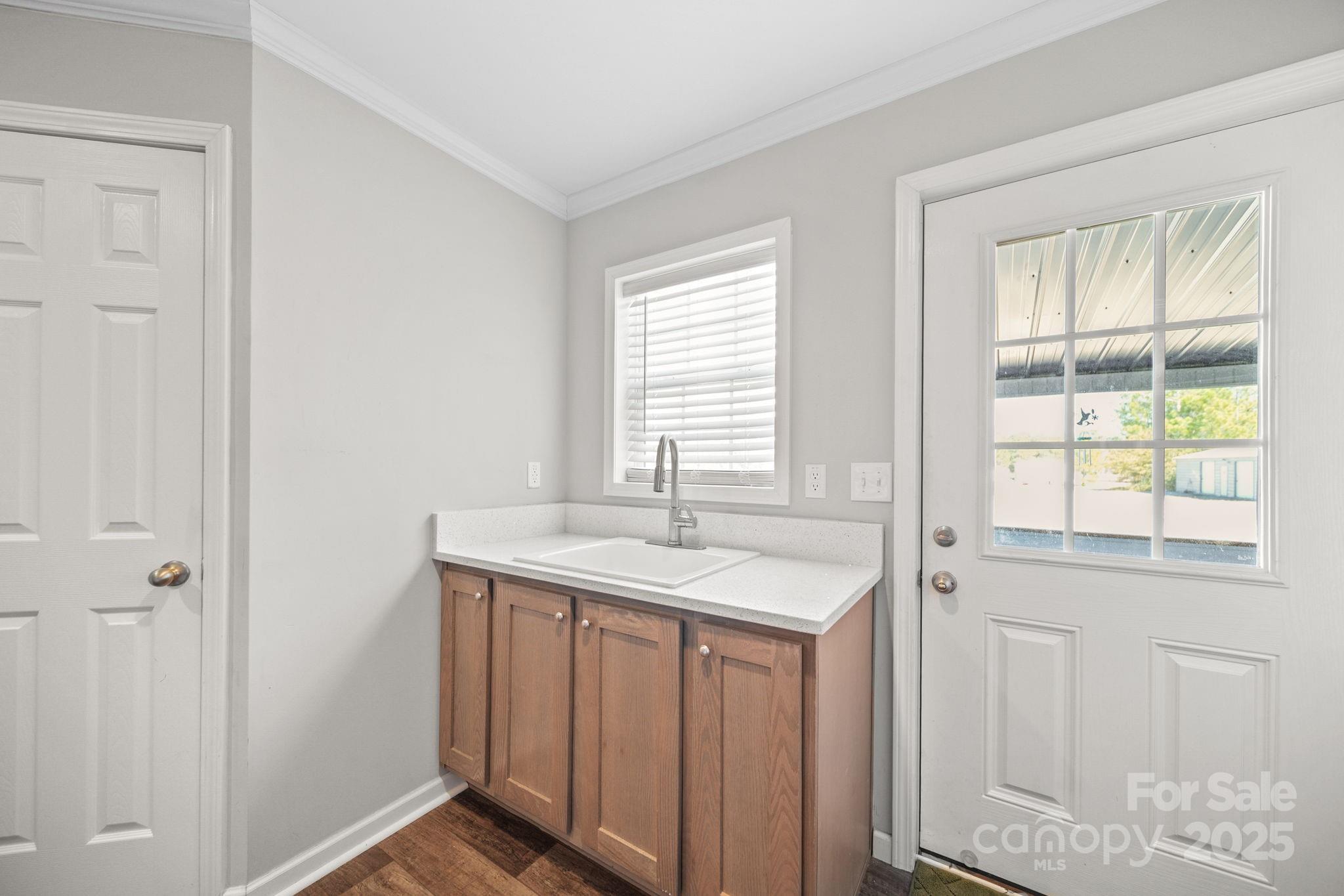 428 Long Branch Jefferson, SC 29718 - Photo 16 of 27 a bathroom with a sink and a window