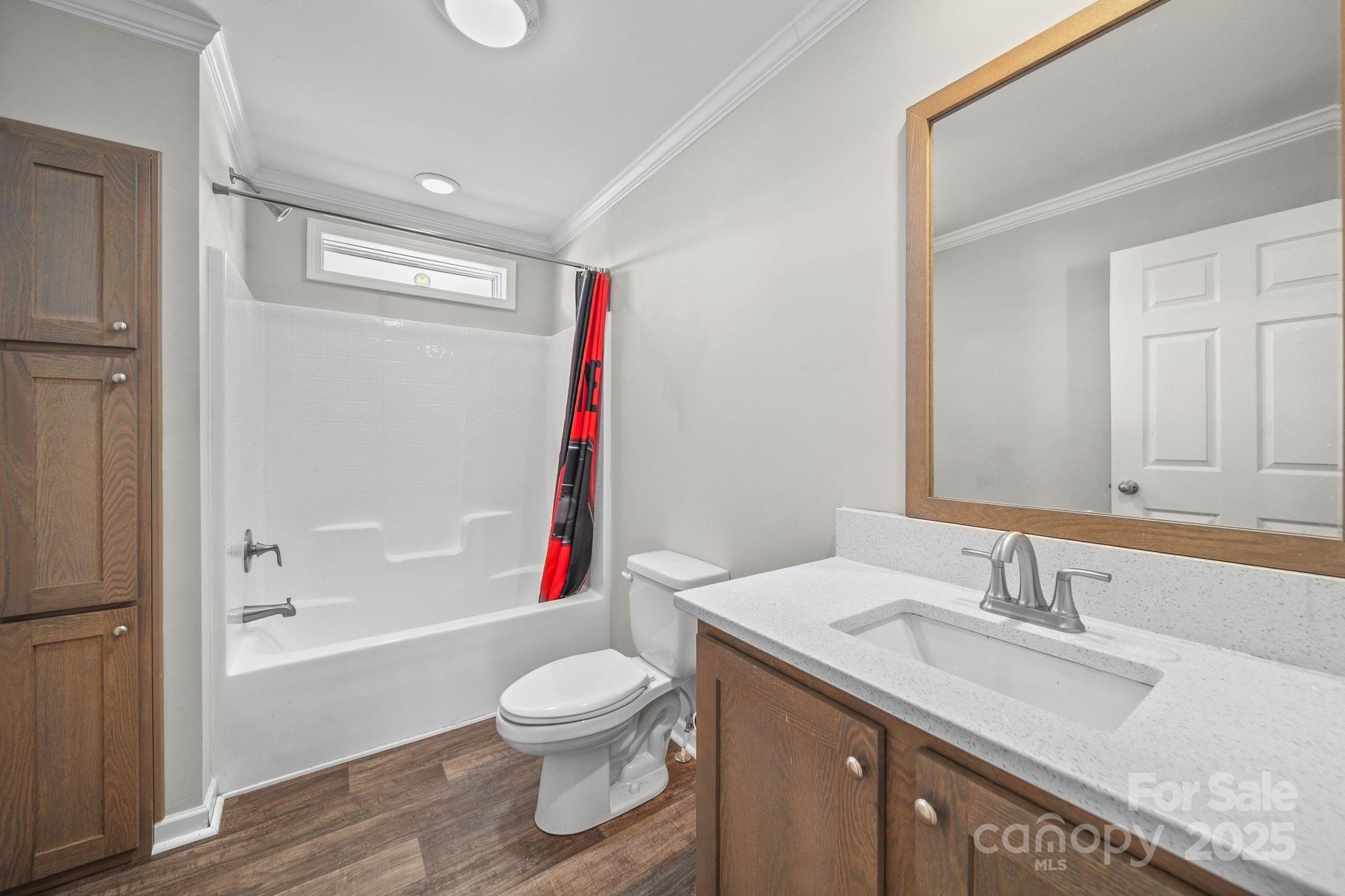 428 Long Branch Jefferson, SC 29718 - Photo 18 of 27 a bathroom with a granite countertop sink toilet and shower