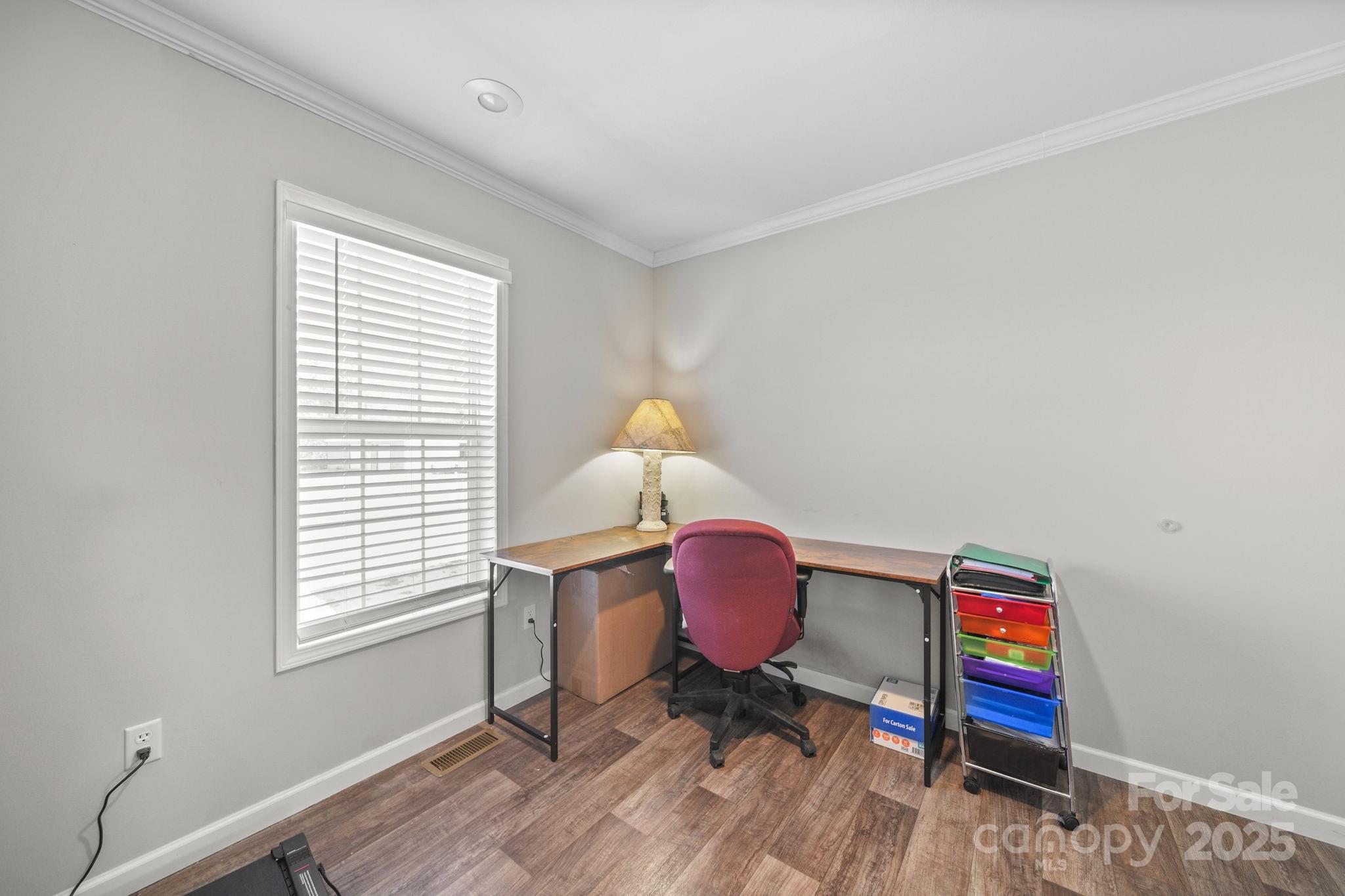 428 Long Branch Jefferson, SC 29718 - Photo 19 of 27 a workspace with furniture and wooden floor