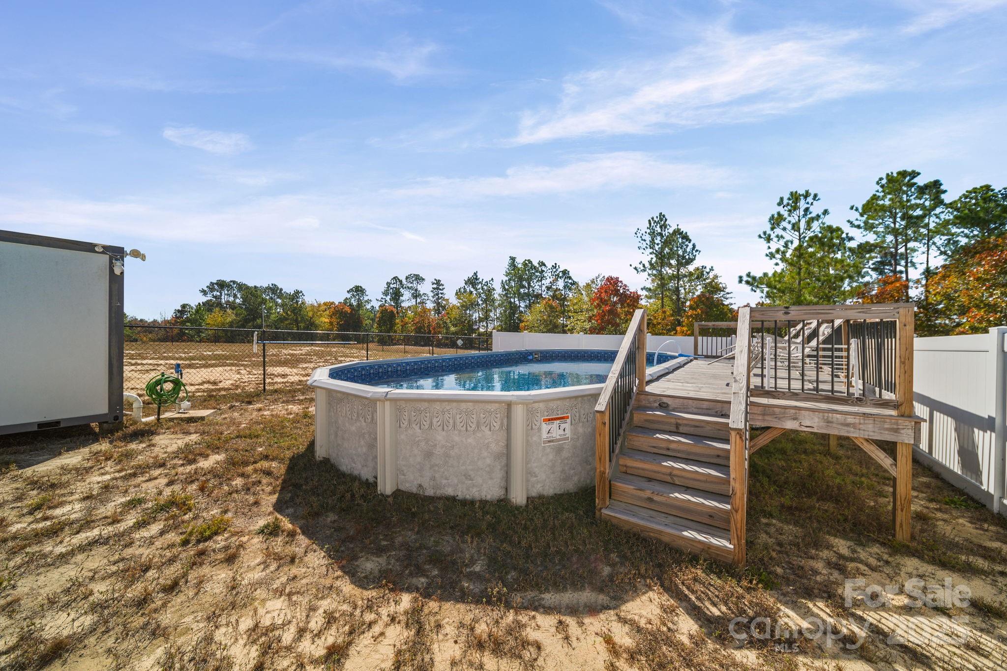 428 Long Branch Jefferson, SC 29718 - Photo 22 of 27 a view of a swimming pool with a lounge chair