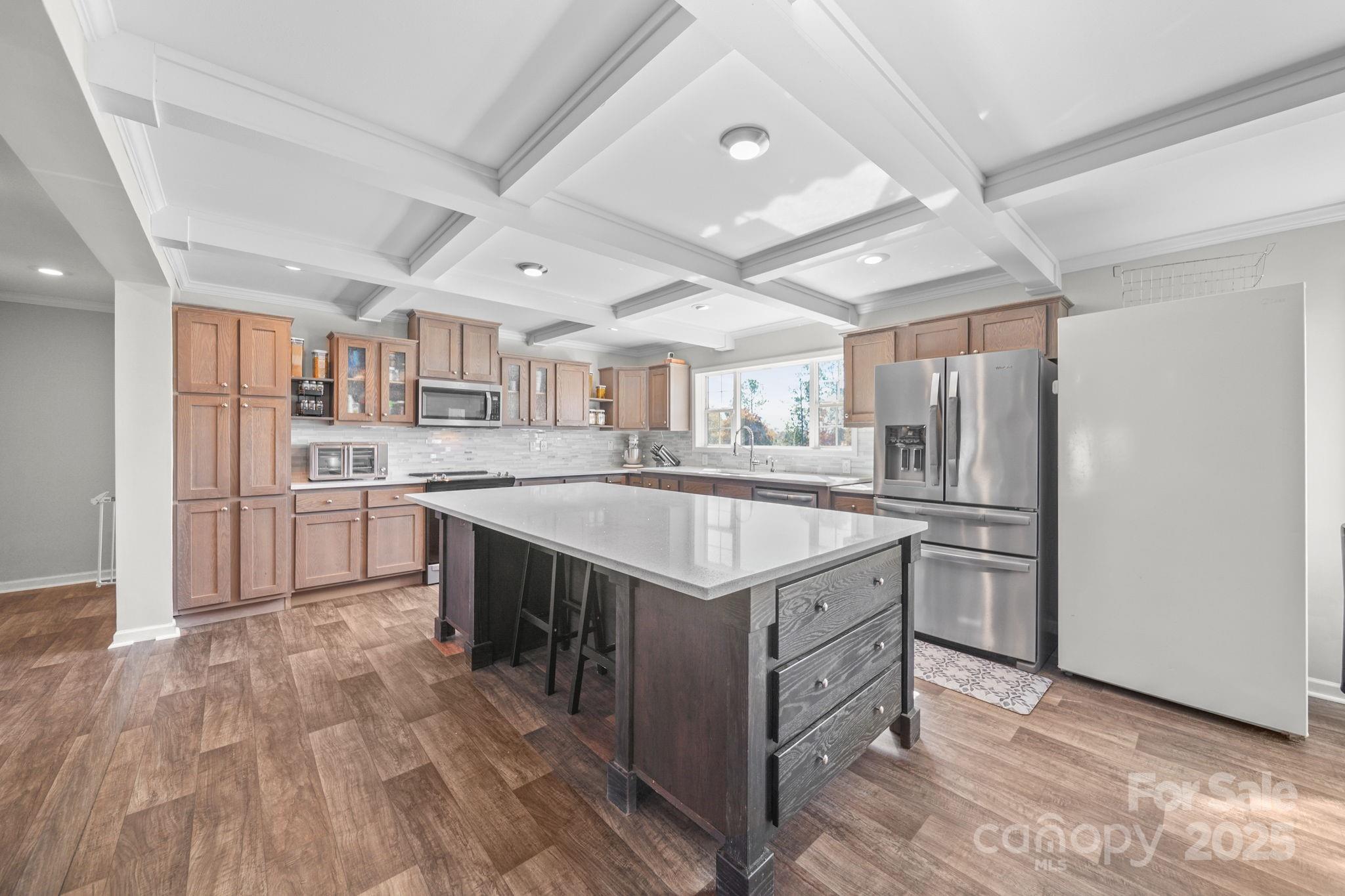 428 Long Branch Jefferson, SC 29718 - Photo 4 of 27 a kitchen with stainless steel appliances granite countertop a sink stove and refrigerator