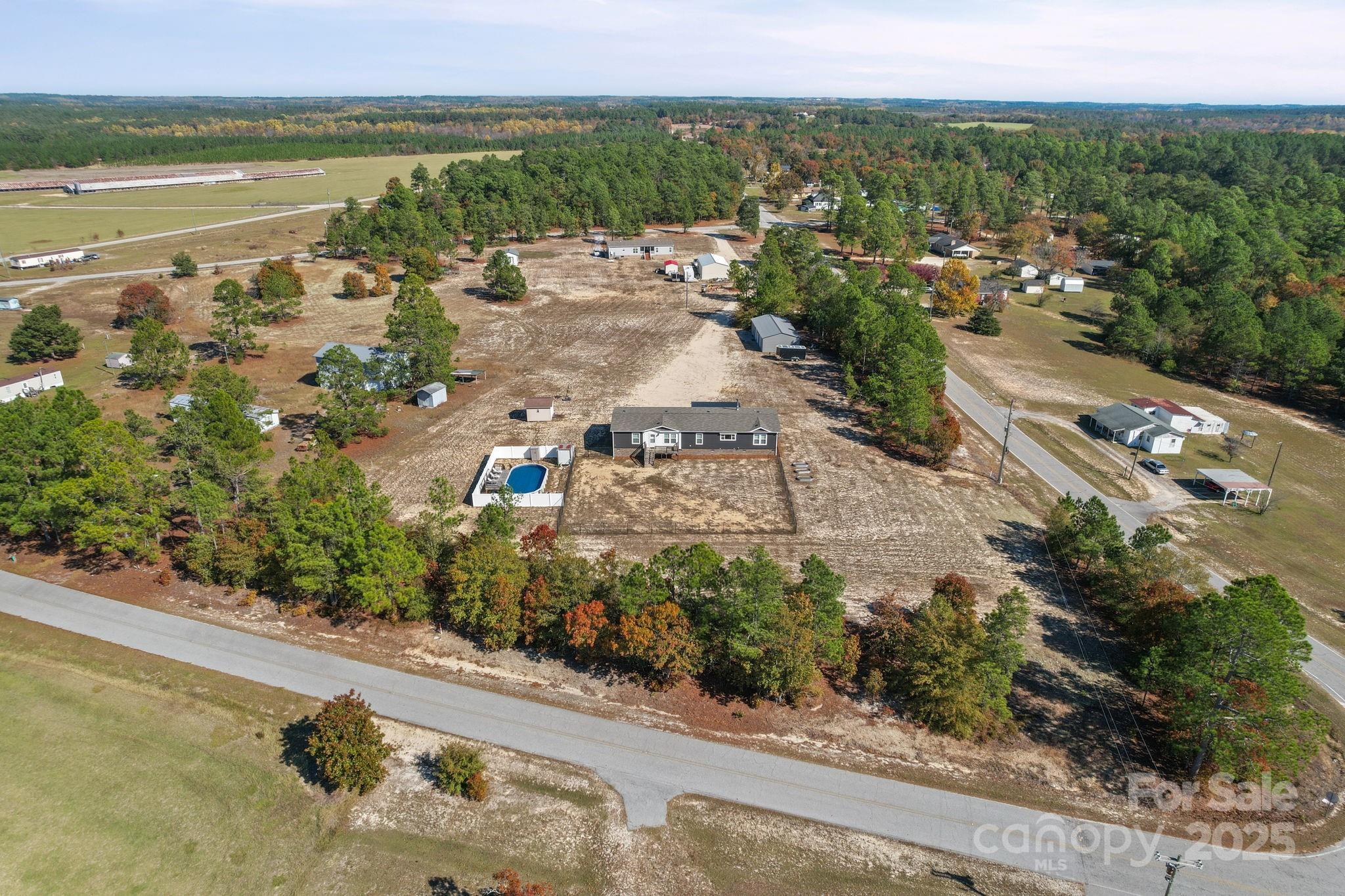 428 Long Branch Jefferson, SC 29718 - Photo 5 of 27 an aerial view of residential houses with outdoor space