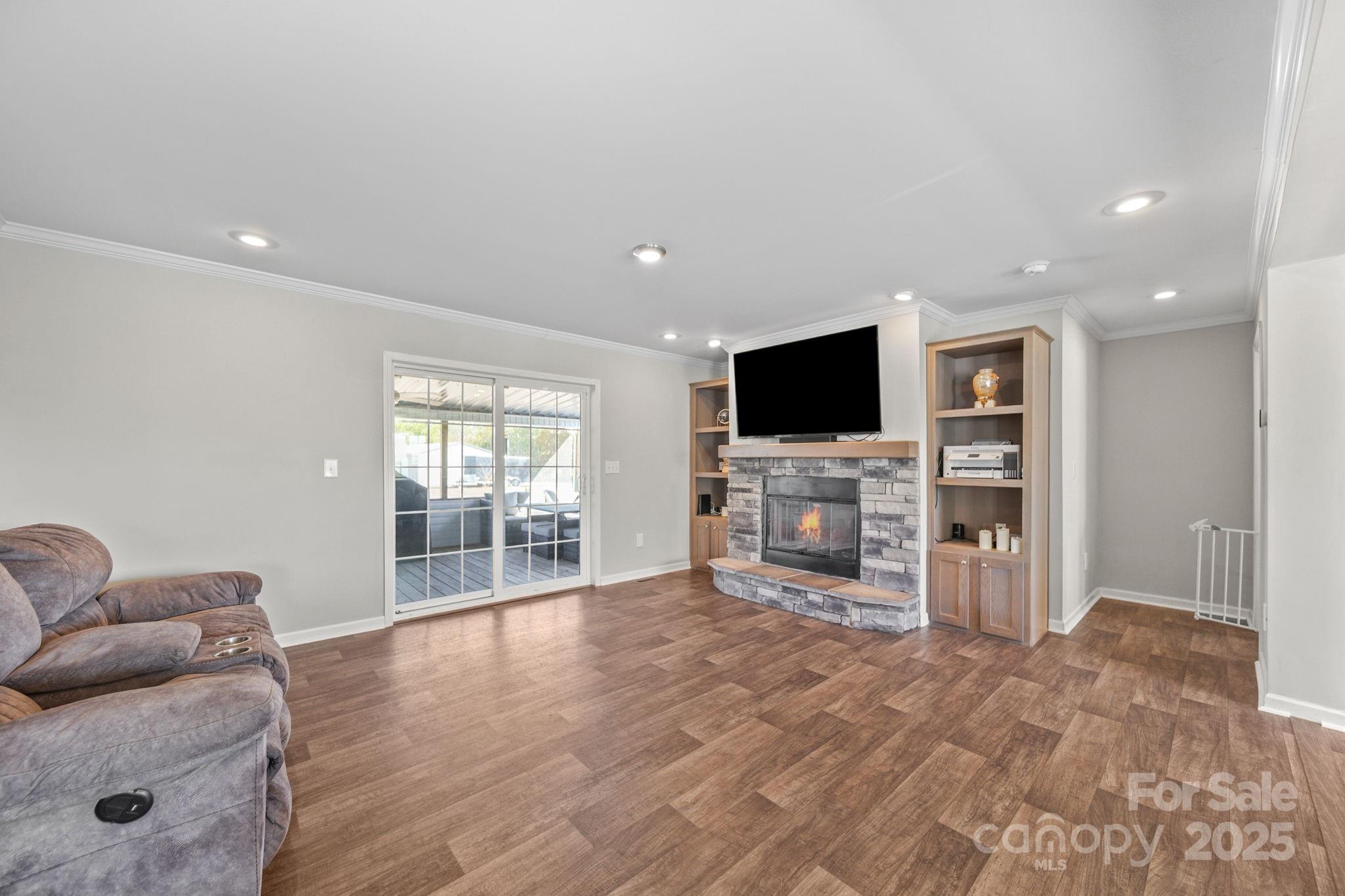 428 Long Branch Jefferson, SC 29718 - Photo 6 of 27 a living room with furniture and a flat screen tv