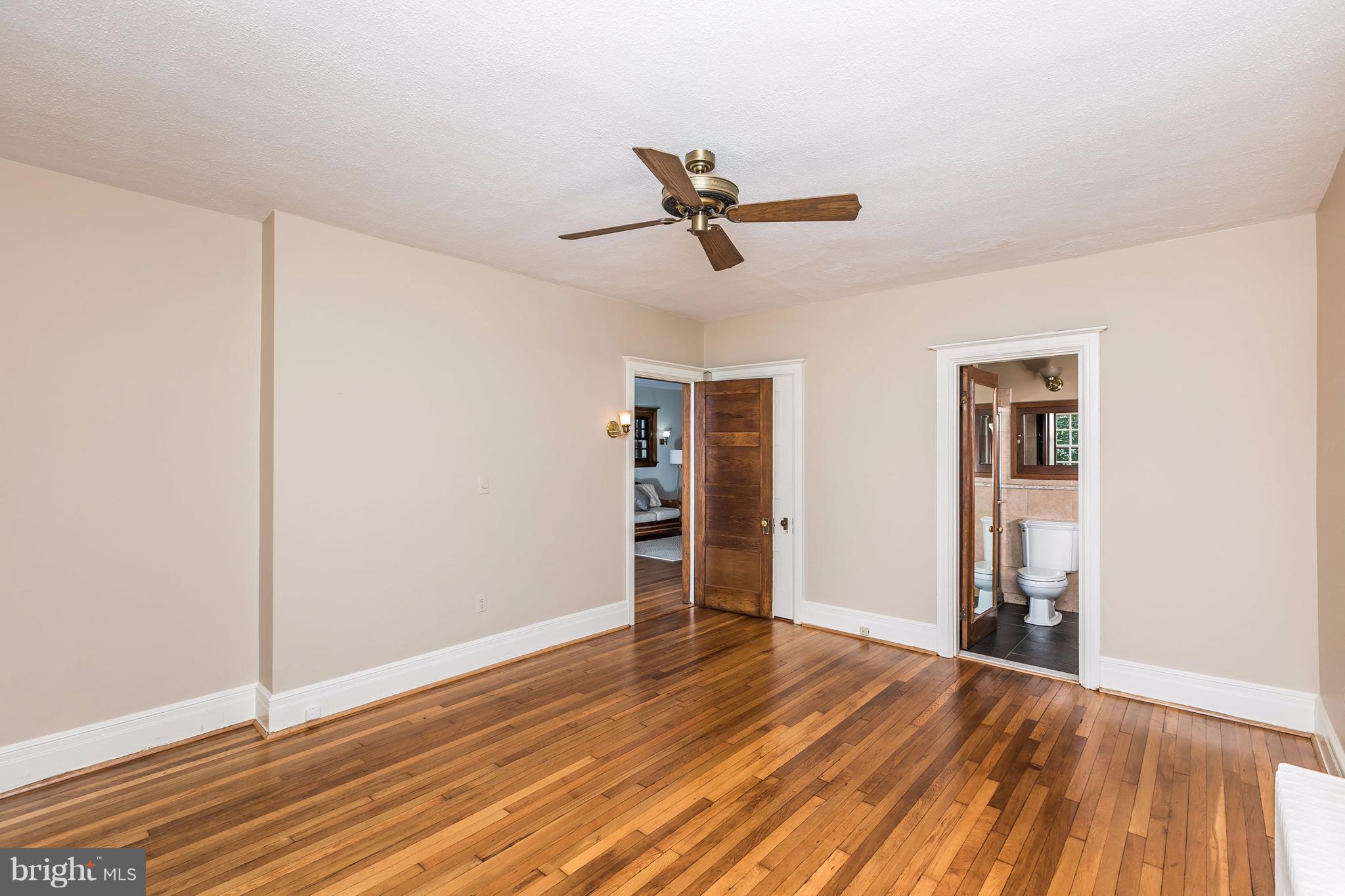 212 Longwood Road Baltimore, MD 21210 - Photo 11 of 30 a view of empty room with wooden floor