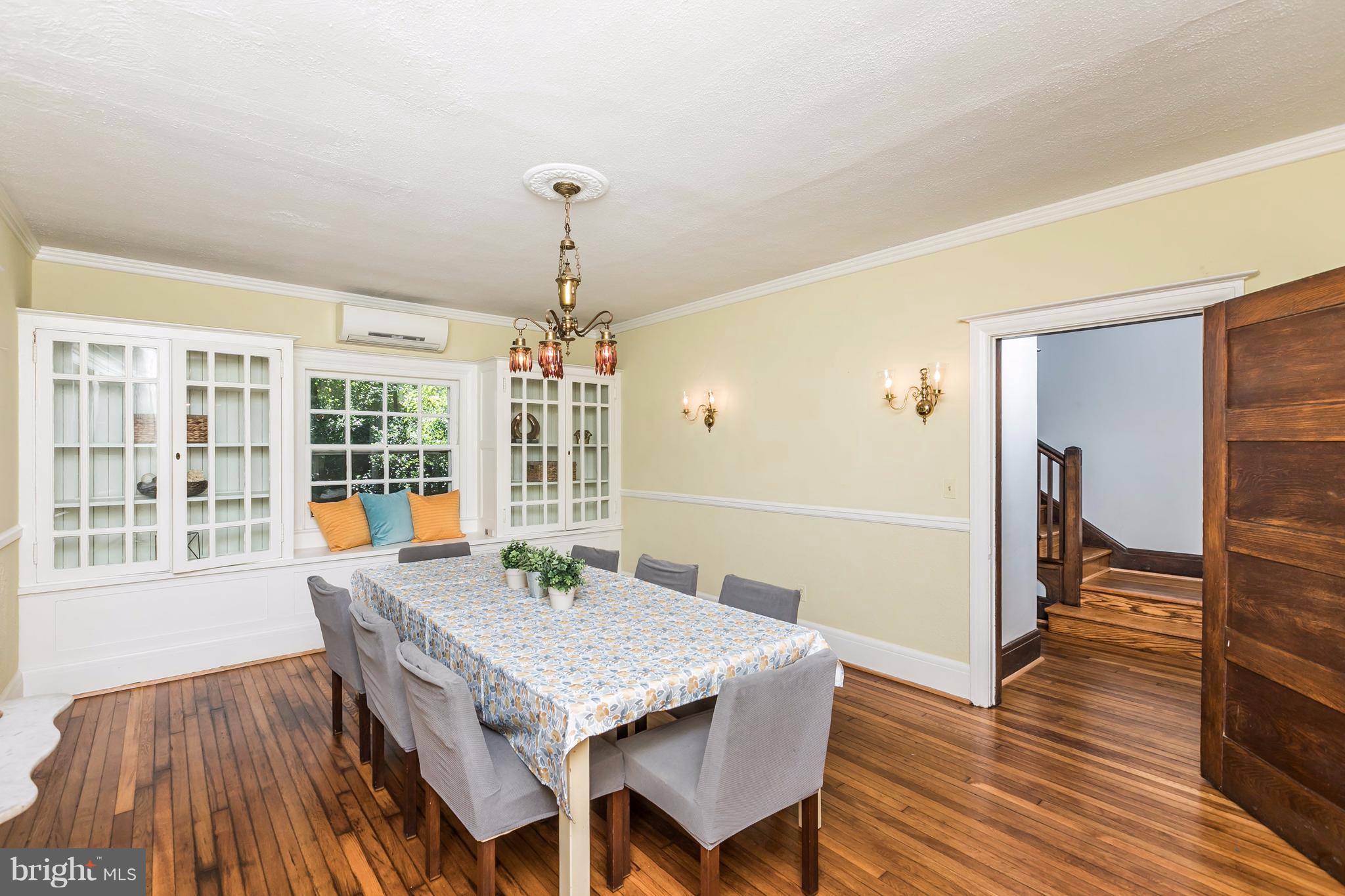 212 Longwood Road Baltimore, MD 21210 - Photo 14 of 30 a view of a dining room with furniture window and wooden floor