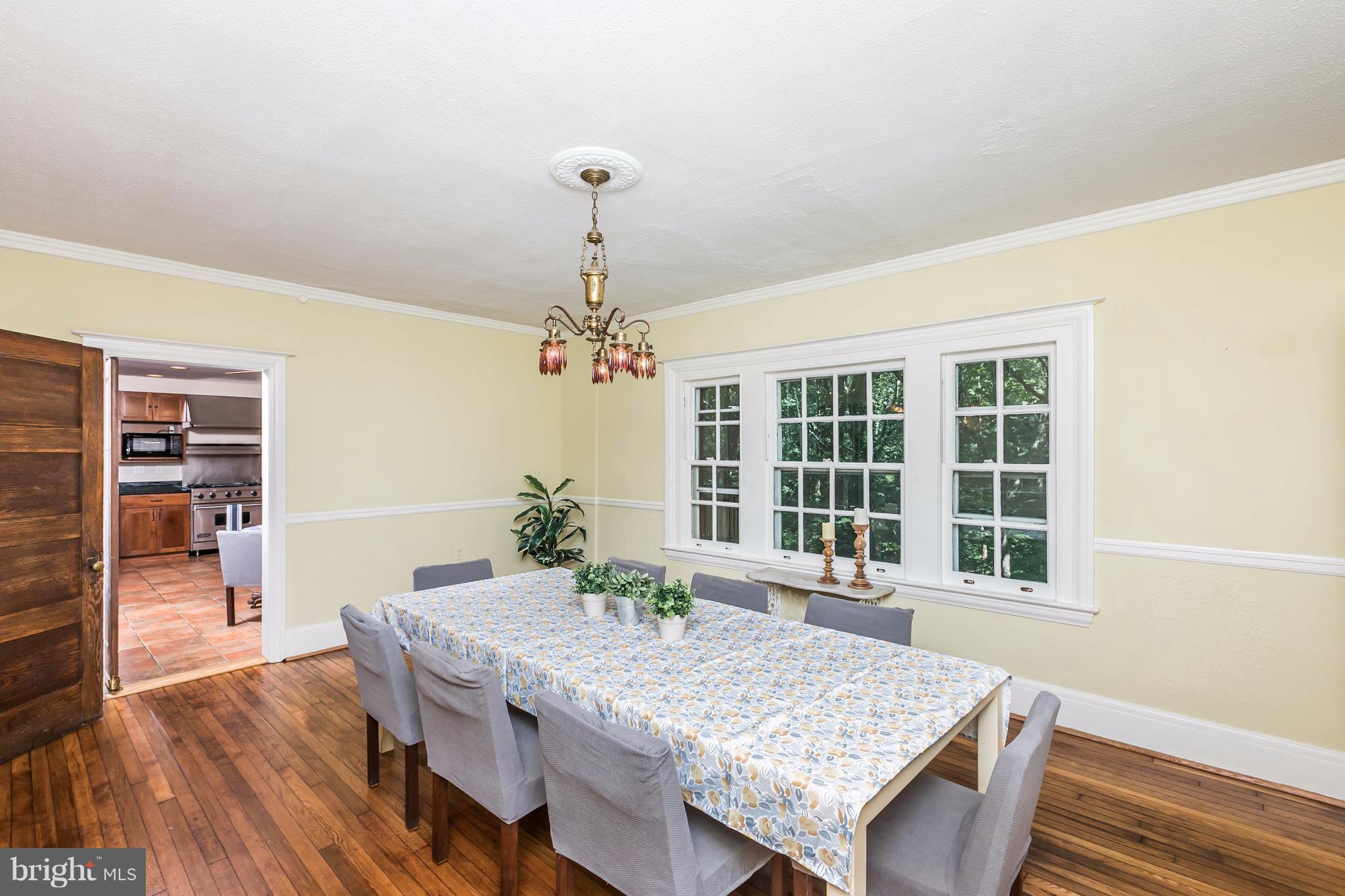 212 Longwood Road Baltimore, MD 21210 - Photo 15 of 30 a view of a dining room with furniture window and wooden floor