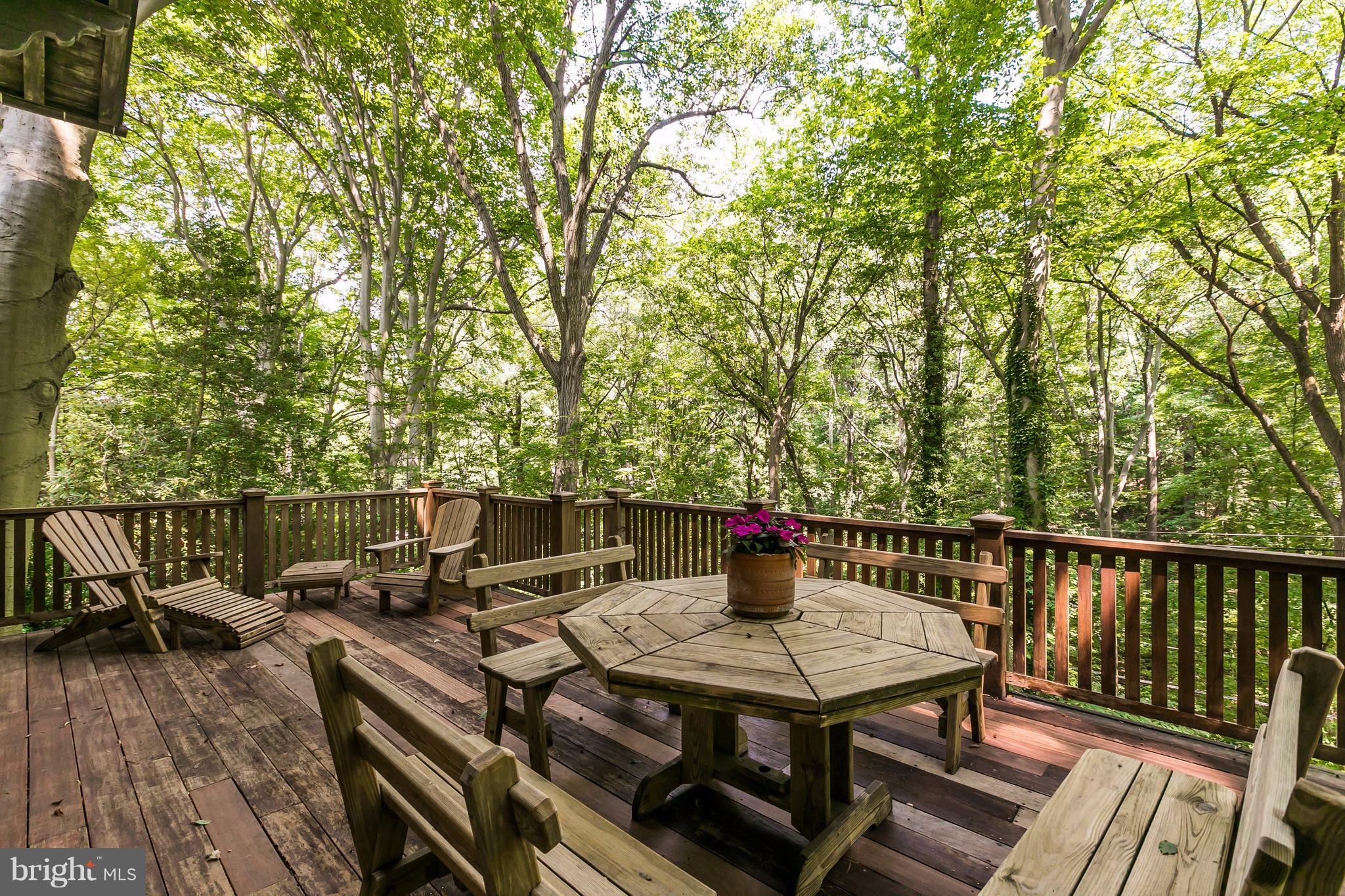 212 Longwood Road Baltimore, MD 21210 - Photo 22 of 30 a view of a chairs and table on the deck