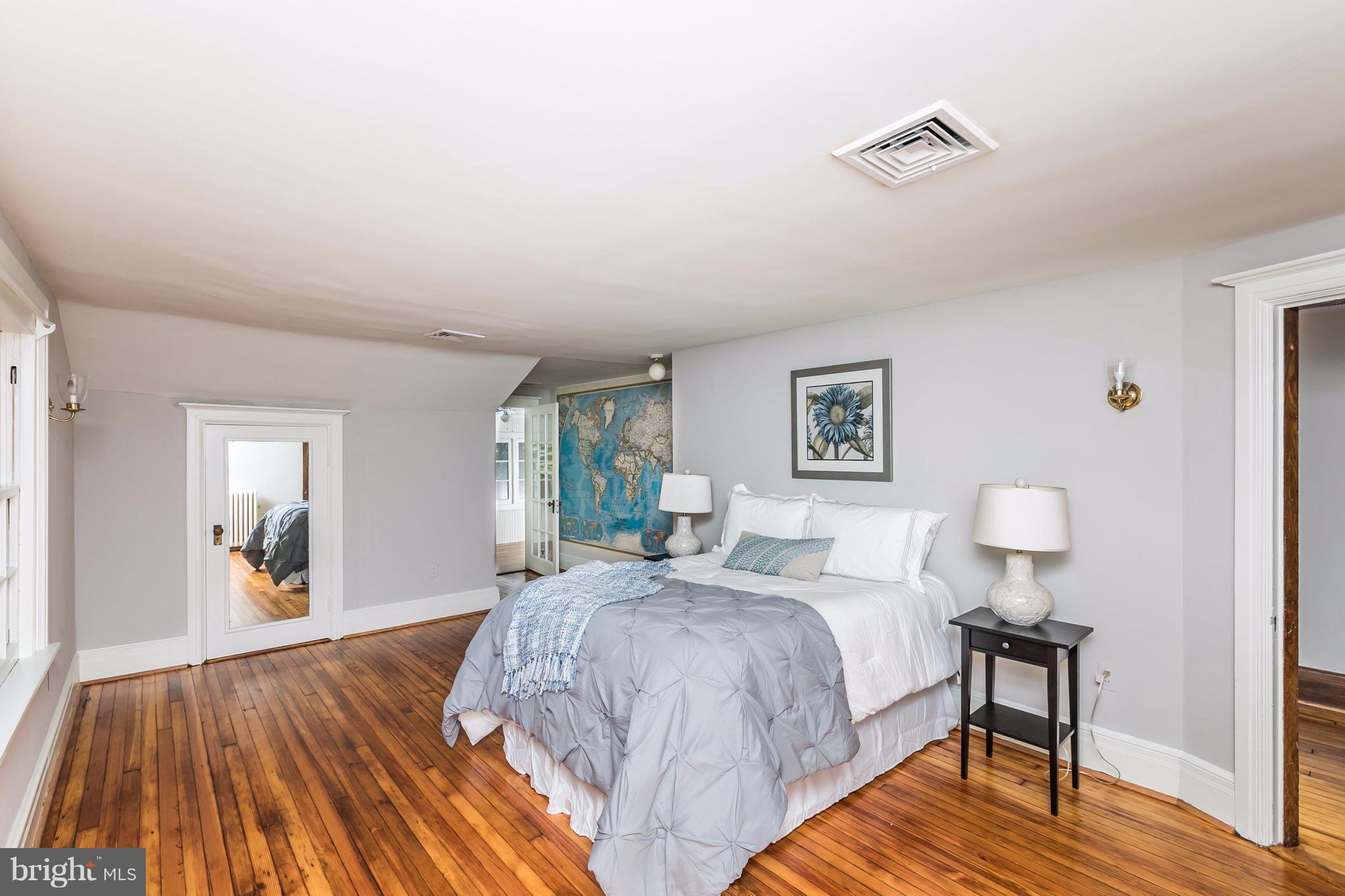 212 Longwood Road Baltimore, MD 21210 - Photo 24 of 30 a spacious bedroom with a bed and wooden floor