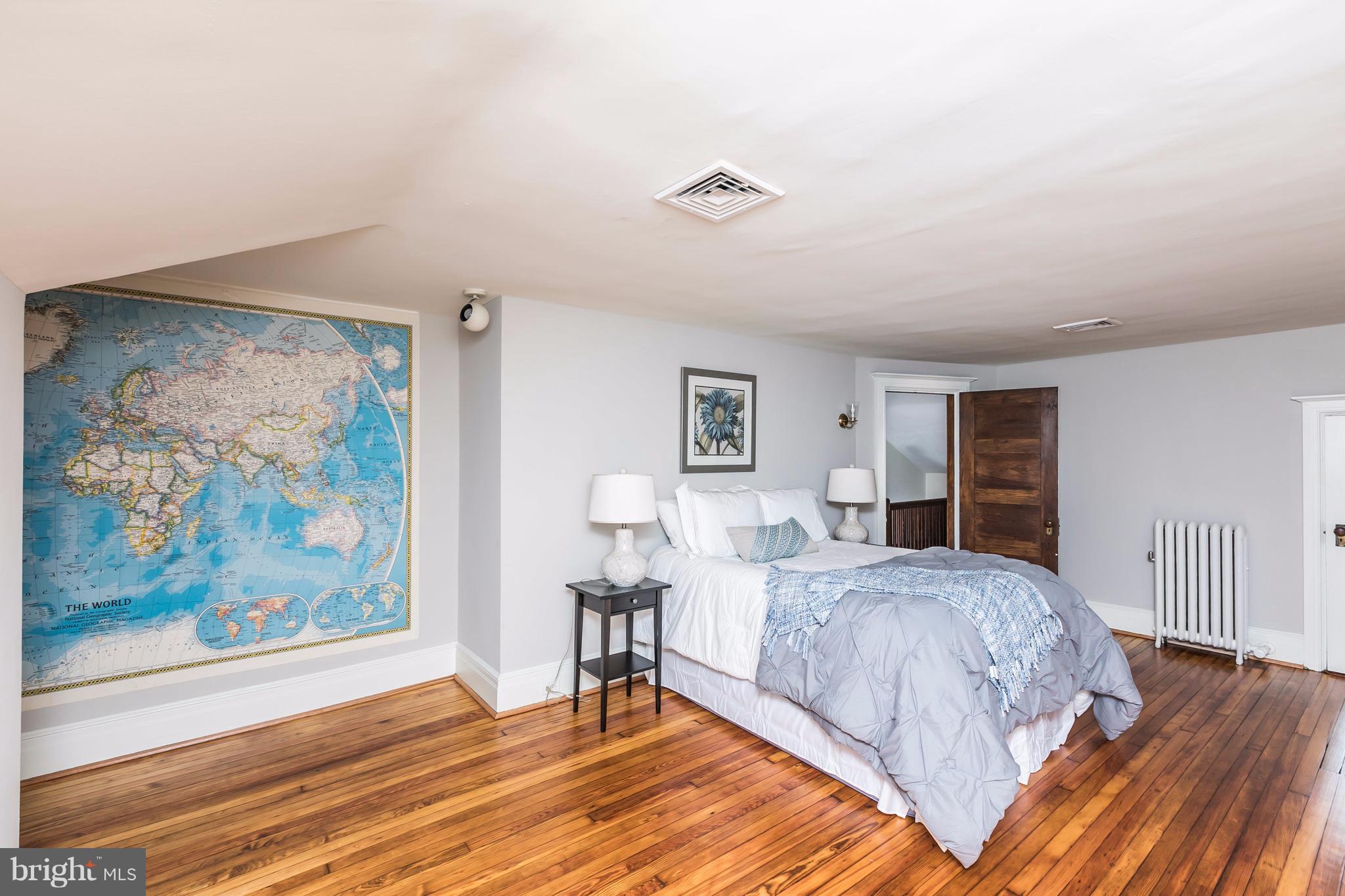 212 Longwood Road Baltimore, MD 21210 - Photo 25 of 30 a bedroom with a bed and a painting on the wall