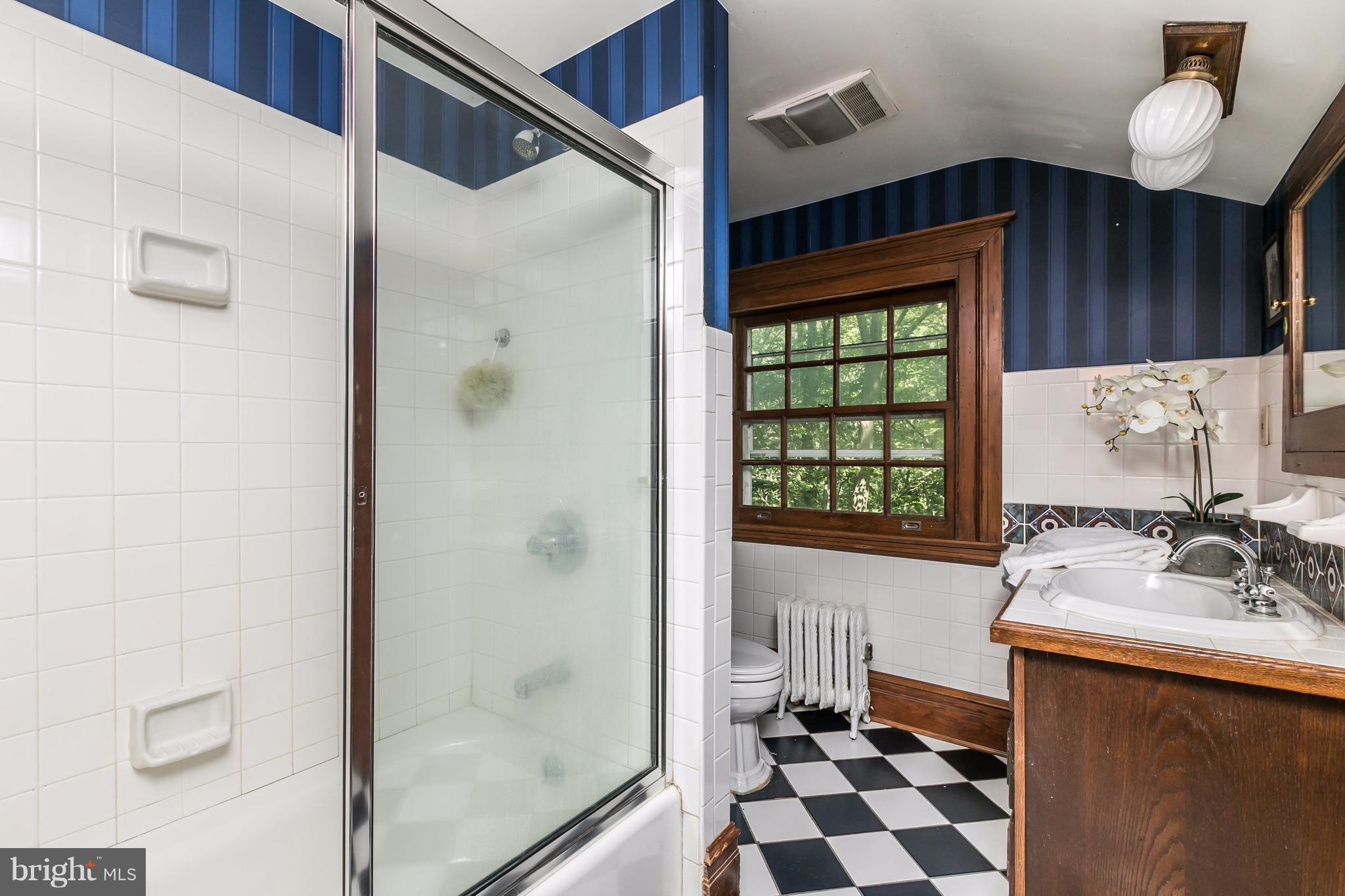 212 Longwood Road Baltimore, MD 21210 - Photo 28 of 30 a bathroom with a sink and a mirror