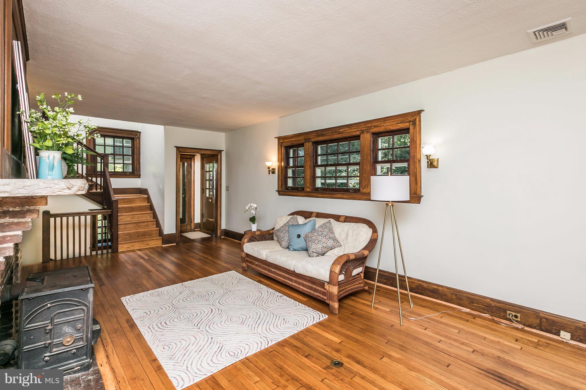 212 Longwood Road Baltimore, MD 21210 - Photo 4 of 30 a living room with furniture and a wooden floor