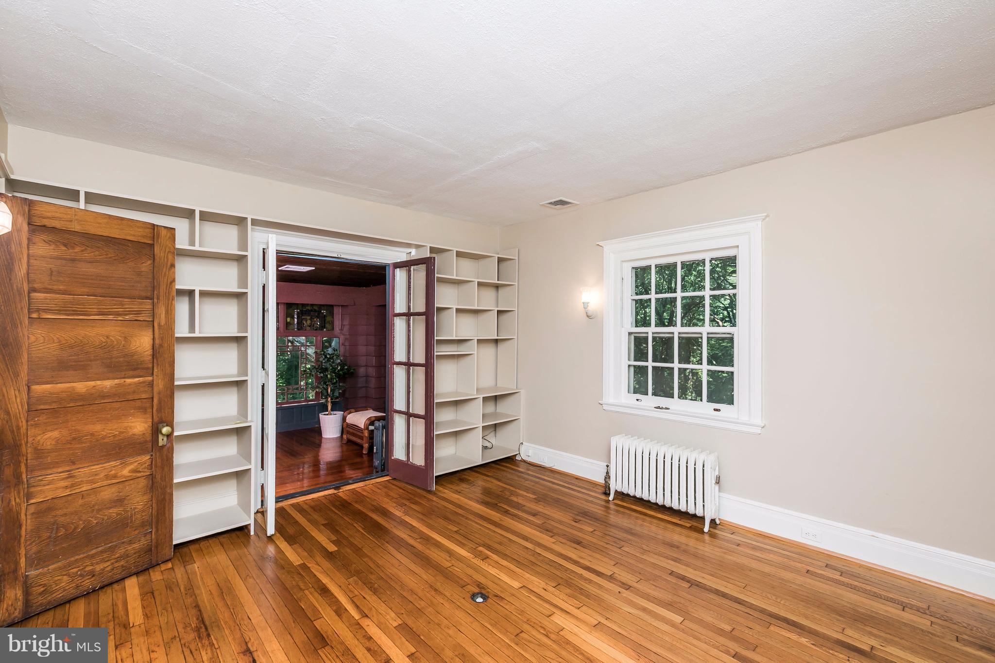 212 Longwood Road Baltimore, MD 21210 - Photo 8 of 30 an empty room with wooden floor closet and windows