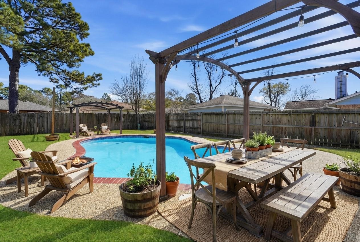 a view of a patio with a table chairs and a table