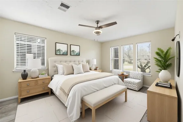 a view of wooden floor and windows in a room