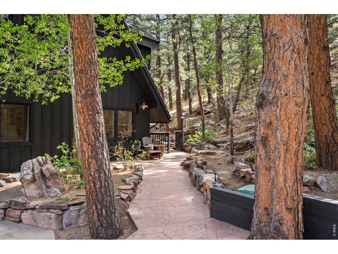 770 North Cedar Brook Road Boulder, CO 80304 - Photo 6 of 50 Inviting flagstone patio entry surrounded by nature