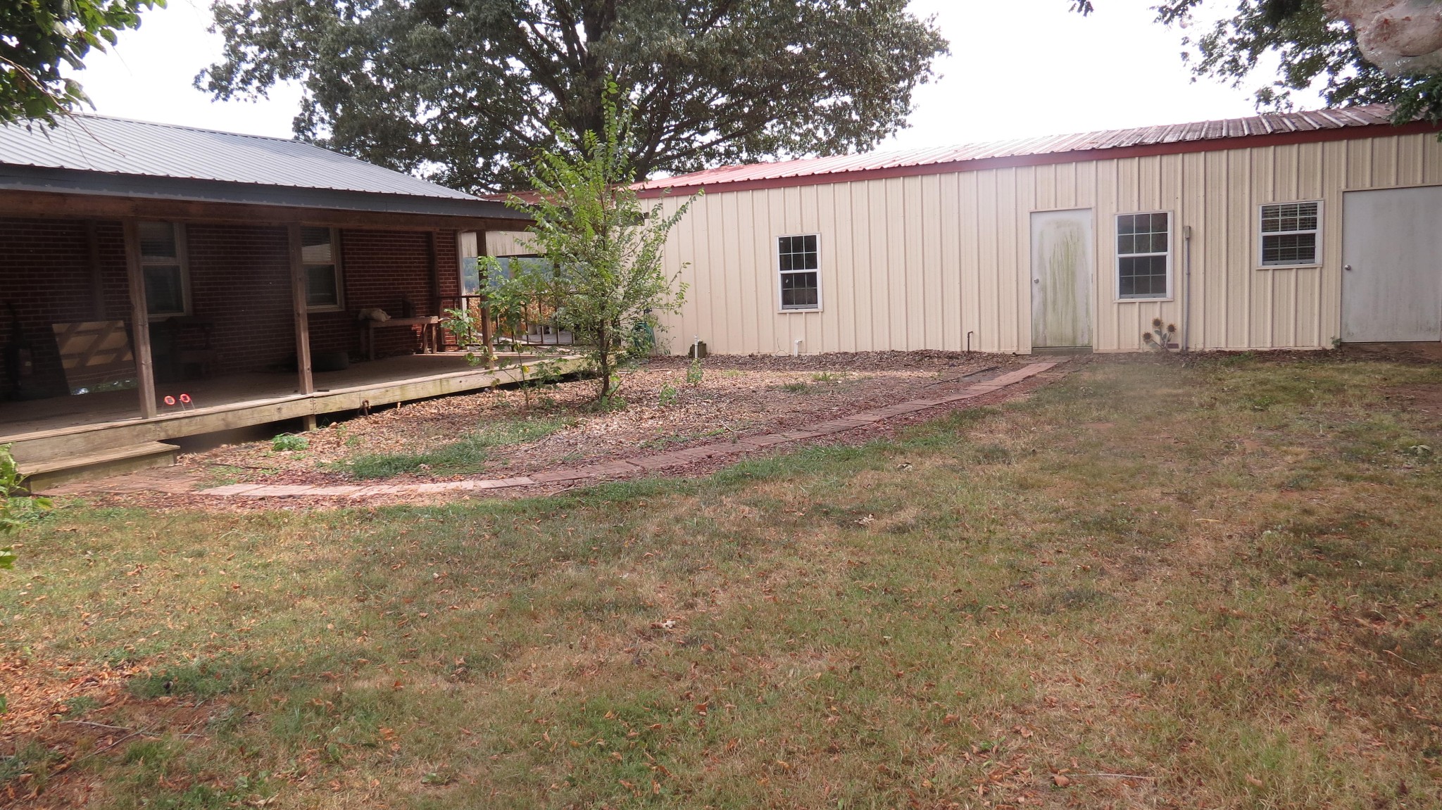 1318 Vise Loop Decaturville, TN 38329 - Photo 42 of 61 a view of a house with backyard and a garden