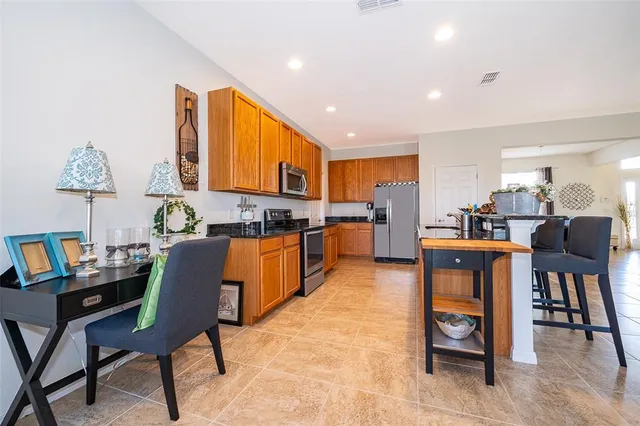 a living room with furniture and kitchen view