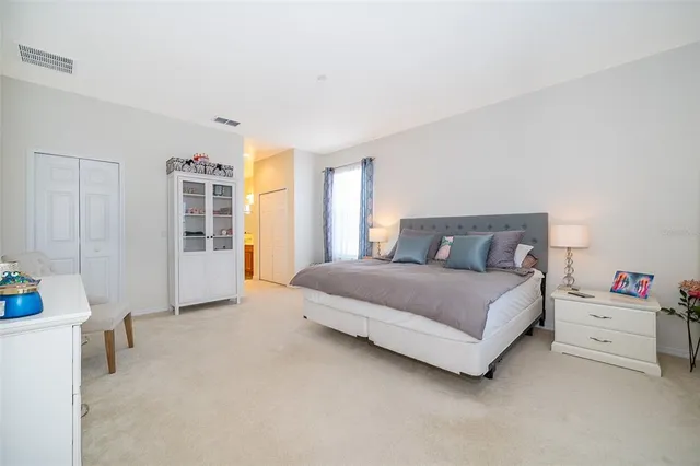 a large bathroom with a granite countertop sink mirror and shower