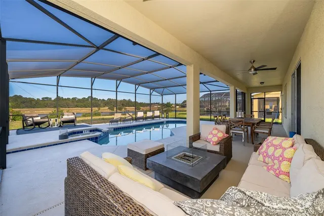 an outdoor space with lots of tables and chairs