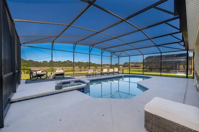 a view of a swimming pool with a patio