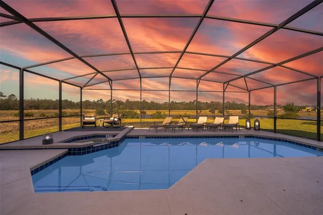 a view of swimming pool with an outdoor space and seating area