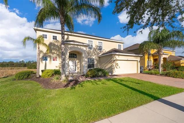 a view of a lake with houses in the back
