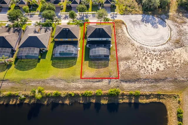 a view of swimming pool with a kitchen island in the background