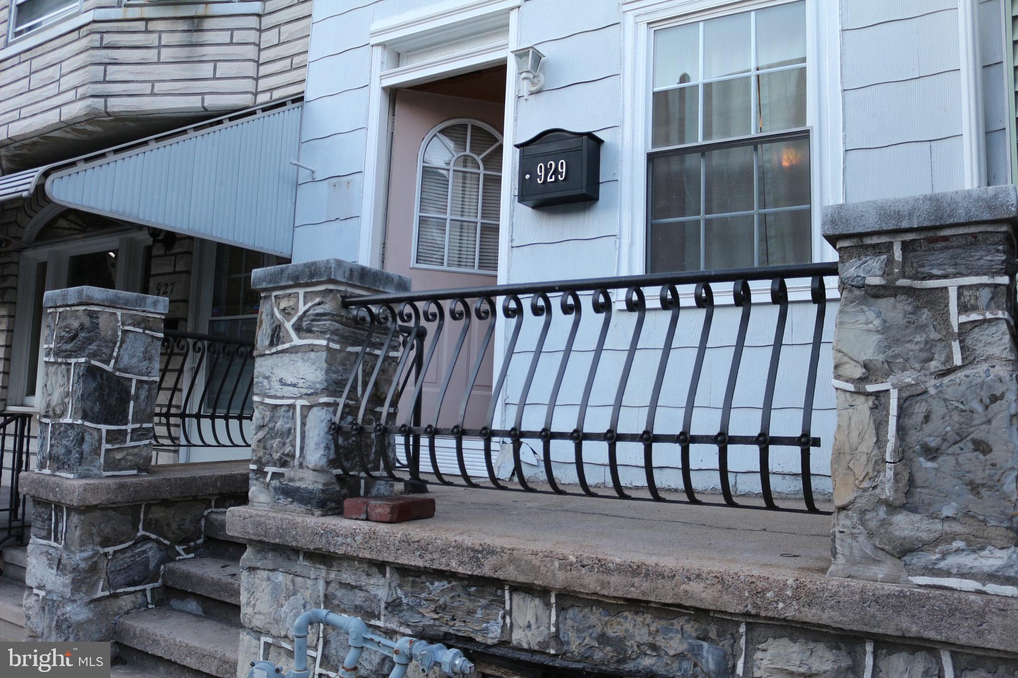 929 Washington Street Reading, PA 19601 - Photo 2 of 14 a backyard of a house with barbeque oven