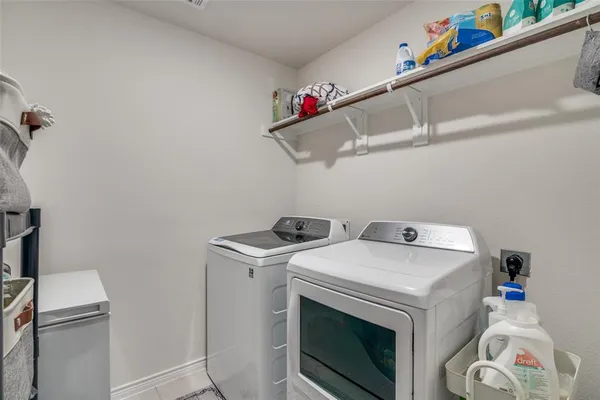 a bedroom with furniture and a chandelier