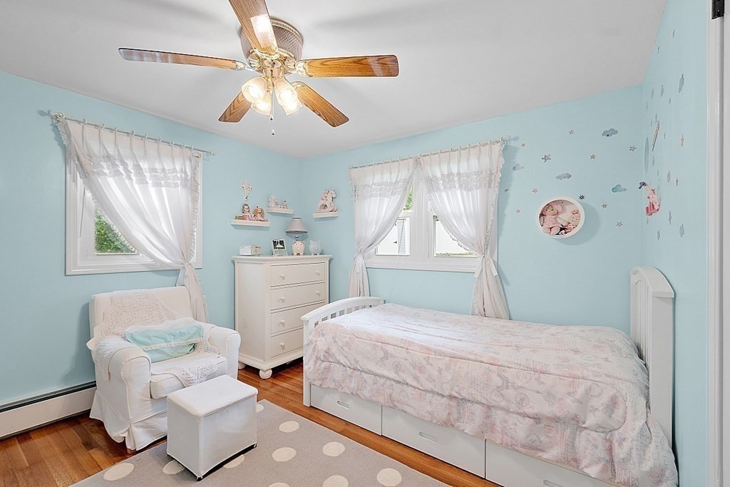 296 St Nicholas Avenue Worcester, MA 01606 - Photo 13 of 32 a bedroom with a bed and a chair