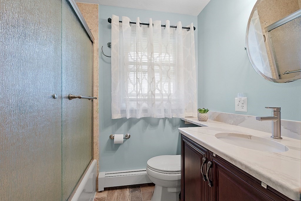 296 St Nicholas Avenue Worcester, MA 01606 - Photo 16 of 32 a bathroom with a sink a toilet and shower