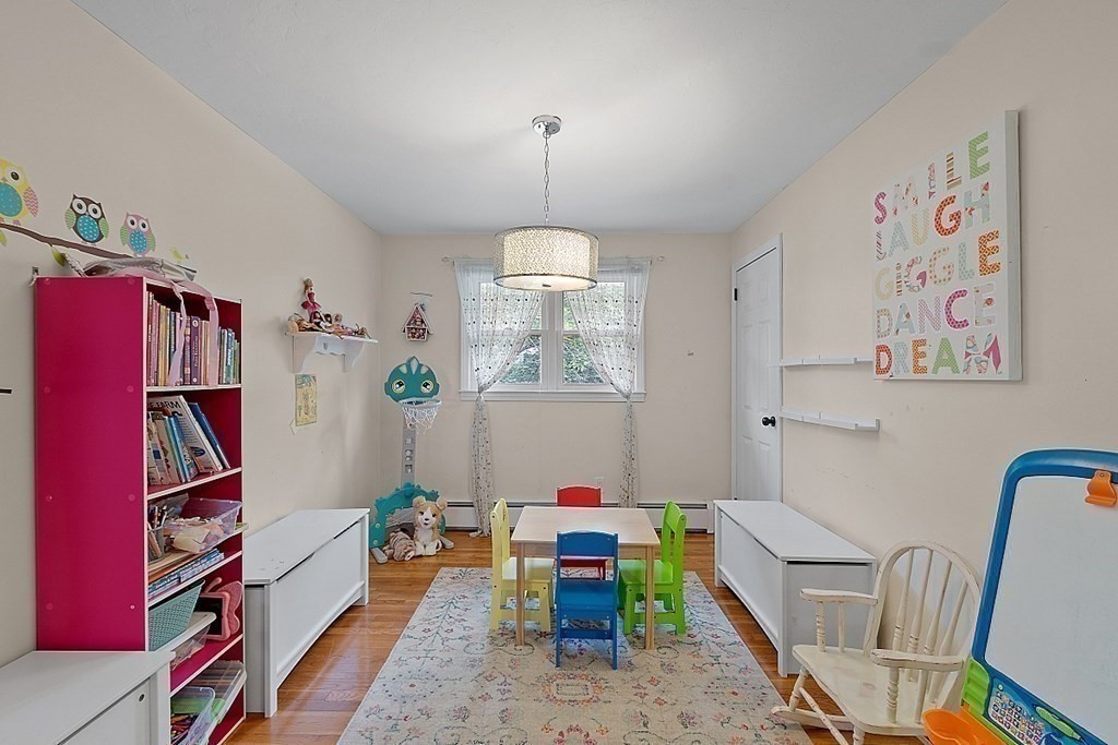 296 St Nicholas Avenue Worcester, MA 01606 - Photo 19 of 32 a room with furniture and book shelf