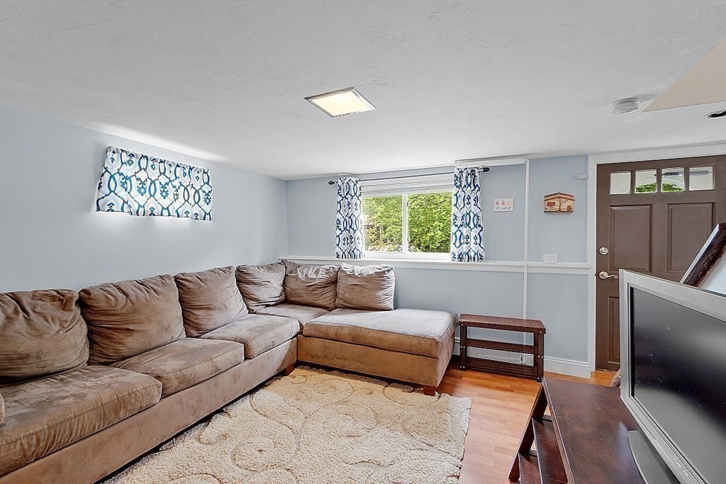 296 St Nicholas Avenue Worcester, MA 01606 - Photo 20 of 32 a living room with furniture and a window