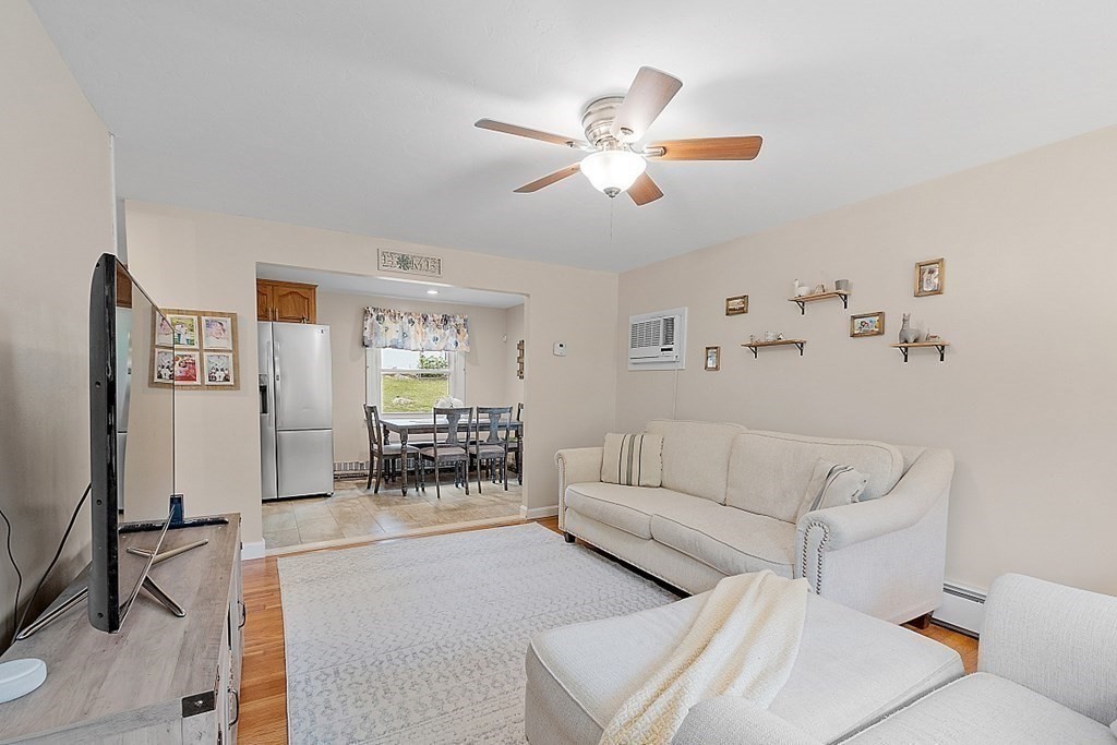 296 St Nicholas Avenue Worcester, MA 01606 - Photo 10 of 32 a living room with furniture and view of kitchen